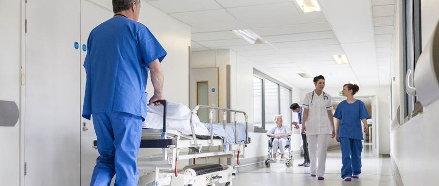 A picture containing clothing, person, indoor, medical equipment

Description automatically generated