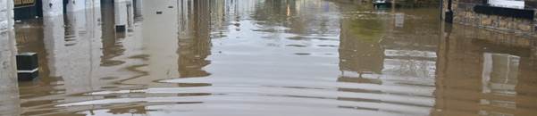 flooded town under blue sky and white clouds