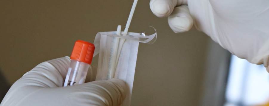 white cotton buds on persons hand
