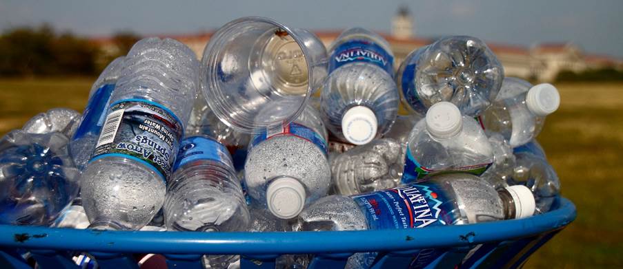 A blue basket full of plastic bottles

Description automatically generated