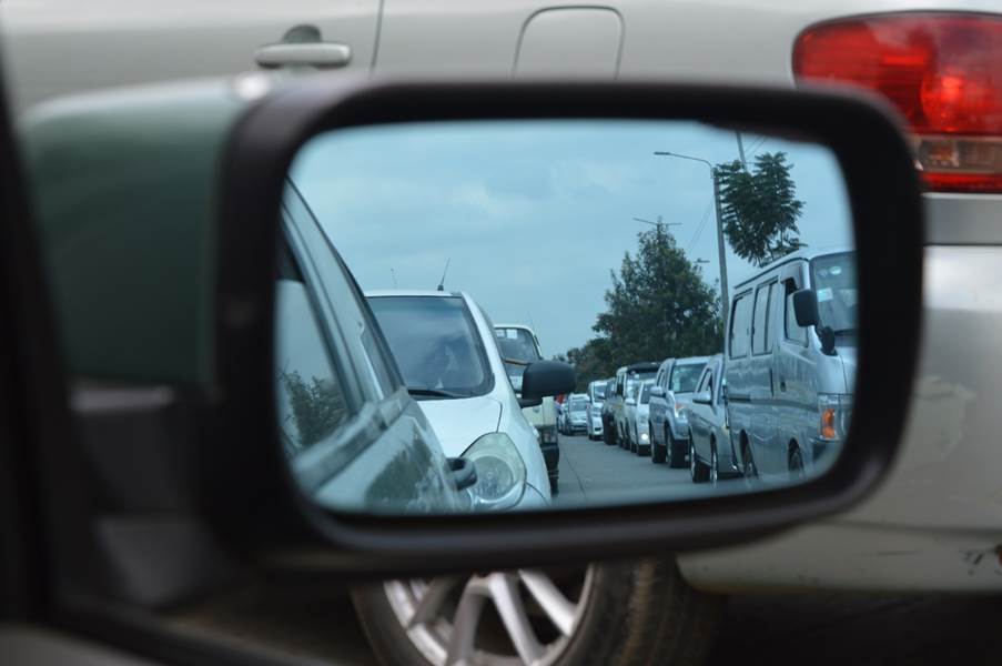 A side mirror of a car

AI-generated content may be incorrect.