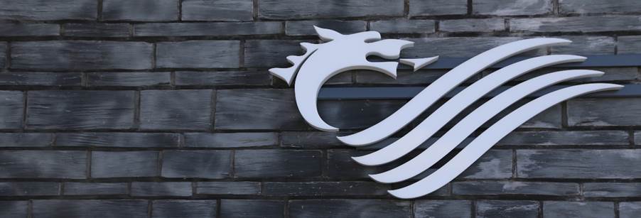 A sign on a brick wall
Description automatically generated