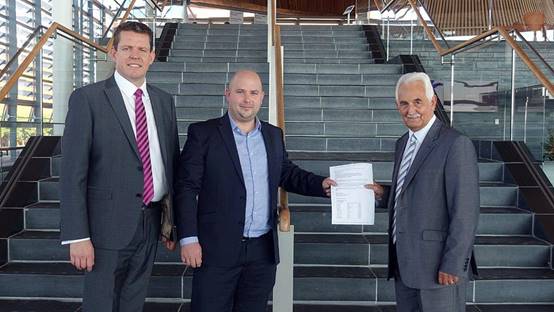 Petitioner handing in a petition to the Petitions Committee